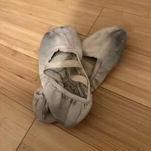 Thoroughly worn pink canvas ballet flats for crafts